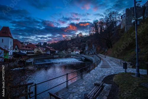 sunset at river next to historical town of cesky krumlov