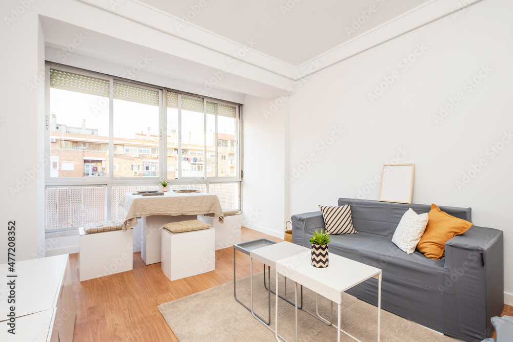apartment living room with large window in vacation rental apartment apartment living room with large window in vacation rental apartment