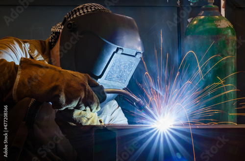 Welding of metal structures by semi-automatic arc welding. MIG welding.