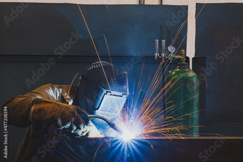 Welding of metal structures by semi-automatic arc welding. MIG welding.