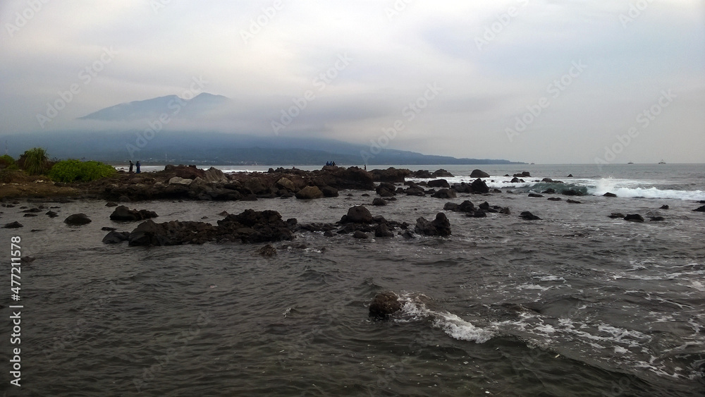 waves hitting rocks in Lampung