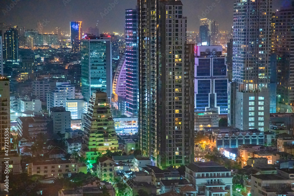 City skyline aerial view at night in Bangkok, Thailand.