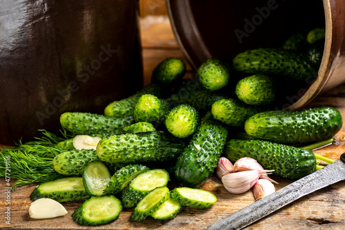 pickled cucumbers in a stone pot