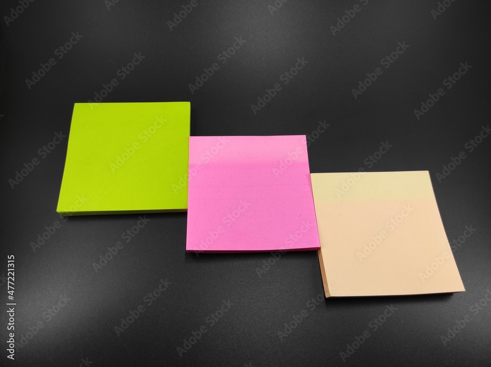 Photo of multicolored paper notes isolated on black background, Not Focus Photo of multicolored paper notes isolated on black background, Not Focus