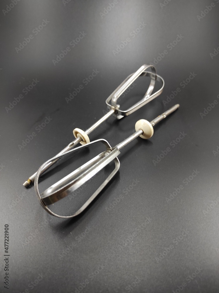 Photo of a whisk mixer isolated on a black background, Not Focus Photo of a whisk mixer isolated on a black background, Not Focus