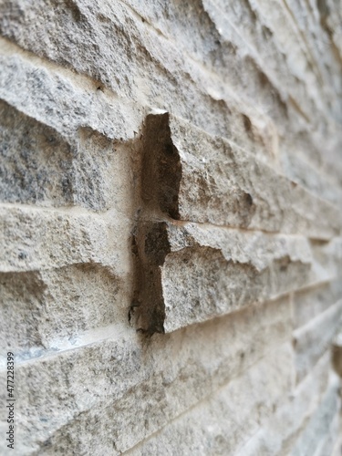 Fototapeta Naklejka Na Ścianę i Meble -  Natural stone surface texture on the walls of the house