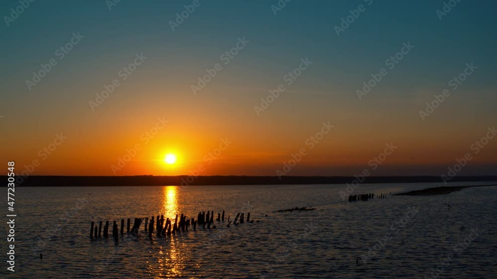 Panoramic sea view with calm peaceful beach in background. Late evening sunset. Panoramic sea view with calm peaceful beach in background. Late evening sunset.