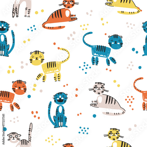 Seamless pattern with cute funny cartoon tigers in naive kid drawn style. Tiny animal characters. photo