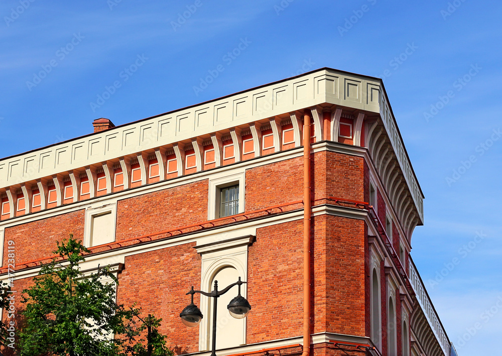Facade of classical building of red color