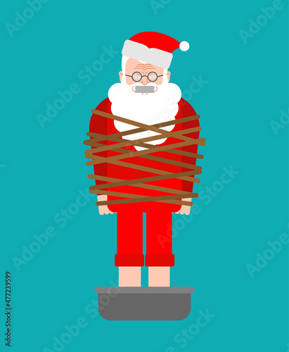 kidnapped Santa Claus. Grandfather tied with rope. There will be no christmas