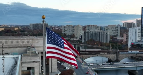 American flag in urban American city. Dawn dusk low light shot. Lifestyle in USA. photo