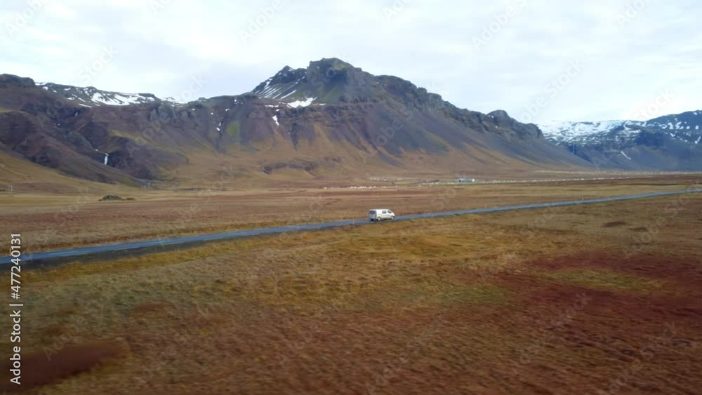 Aerial view of white van driving on road in Iceland Aerial view of white van driving on road in Iceland