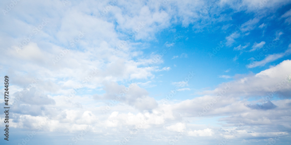 Blue sky with white altocumulus clouds on a daytime, natural photo Blue sky with white altocumulus clouds on a daytime, natural photo