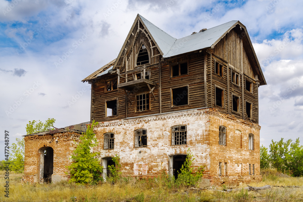 The building of an old abandoned mill in the countryside. The picture was taken in the village of Pervokrasnoe, in the Orenburg region