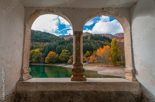 Villalago (Abruzzo, Italy) - A view of medieval village in province of L'Aquila, situated in the gorges of Sagittarius, with Lago San Domenico lake, bridge and sanctuary. Here during autumn foliage photo