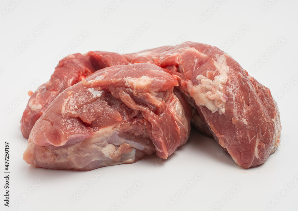 a large piece of fresh meat isolated on white. close-up