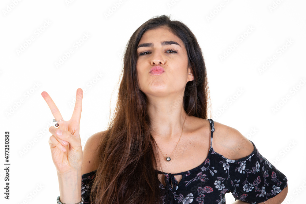 beautiful happy love woman makes a v with fingers victory sign and send kiss with her mouth beautiful happy love woman makes a v with fingers victory sign and send kiss with her mouth