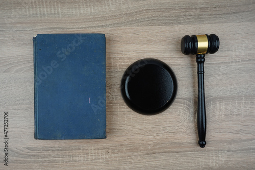 Close up gavel and sound block with old book from top view