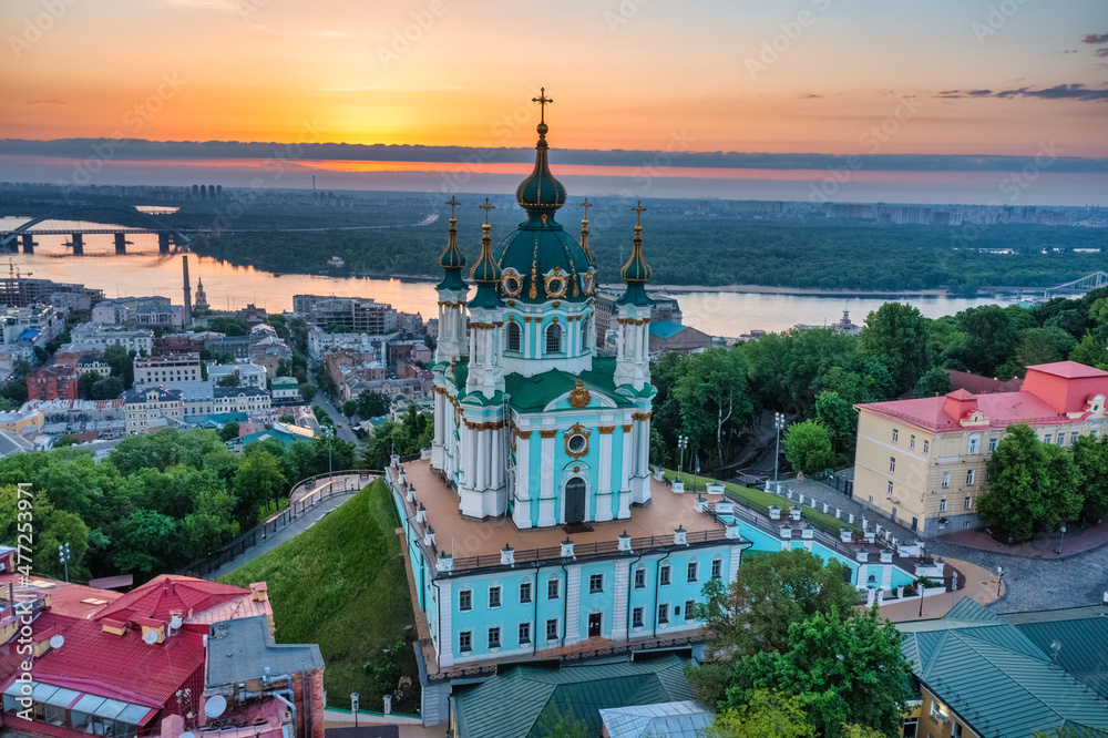 Fototapeta premium Aerial view of St. Andrew's Church during dawn, one of the most famous sights of the city of Kiev. Cityscape concept, tourism, vacation, travel