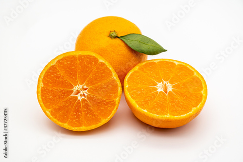 Ripe tangerines on the white background.