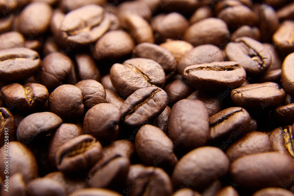Naklejka premium roasted coffee beans background