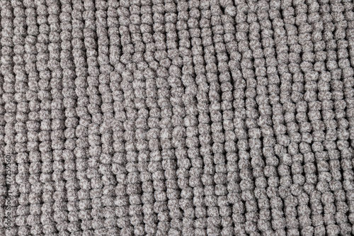 Gray chenille soft bath mat texture background. Bath Accessories. Top view.