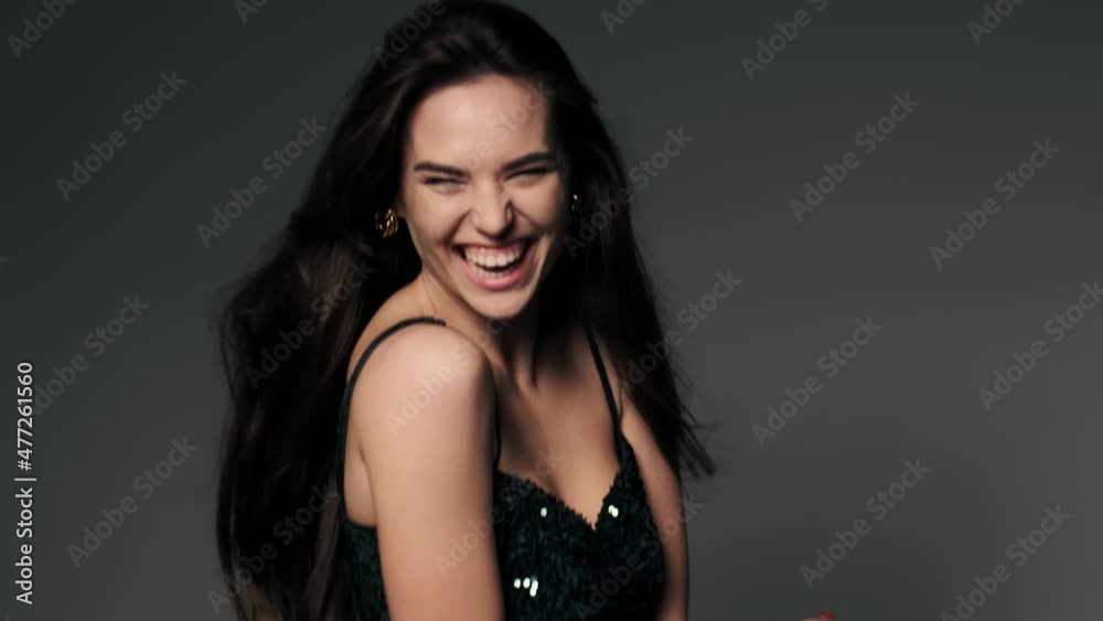 Attractive, sexy brunette girl is dancing in the formal dress 4K. Party atmosphere Attractive, sexy brunette girl is dancing in the formal dress 4K. Party atmosphere