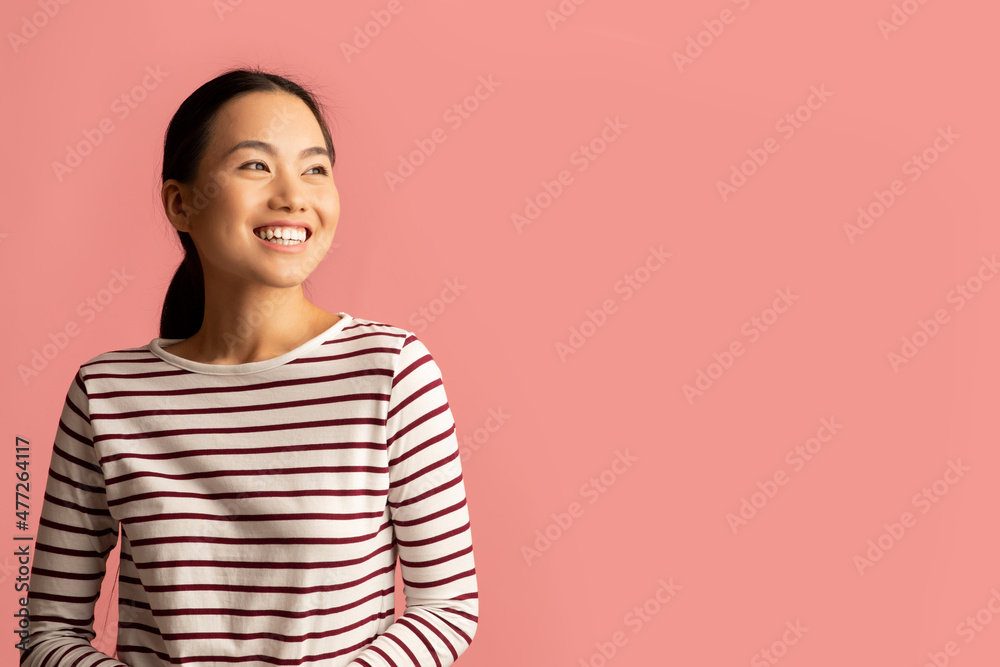 Portrait Of Happy Young Asian Female Looking Away With Excitement Portrait Of Happy Young Asian Female Looking Away With Excitement
