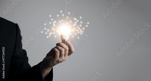 Hands holding light bulbs. Concept of Ideas to present new ideas, inspiration, great innovations, new beginnings, creativity and technological innovations of the future.