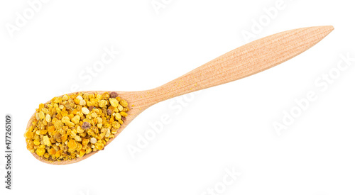 top view of wooden spoon with portion of natural bee pollen isolated on white background
