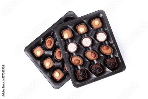 Chocolate candies in box isolated on white background