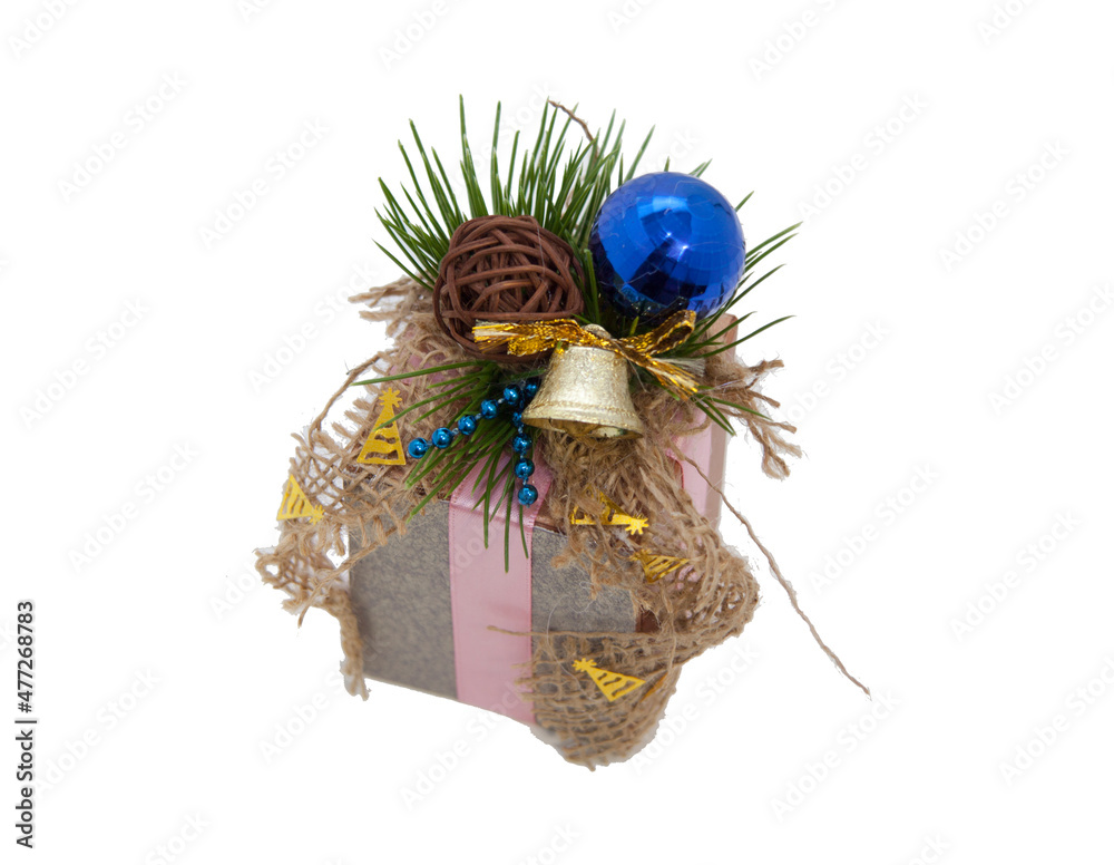 Christmas beautiful gift wrapping. Fir cones and needles. Tied with a satin ribbon. blue ball. On a white isolated background