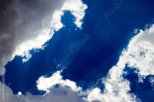 view of white cumulus clouds against a blue sky