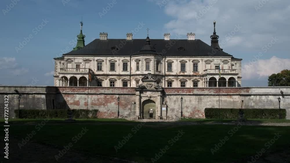 Historical estate in a green forest. Drone aerial view of a fabulous castle Historical estate in a green forest. Drone aerial view of a fabulous castle