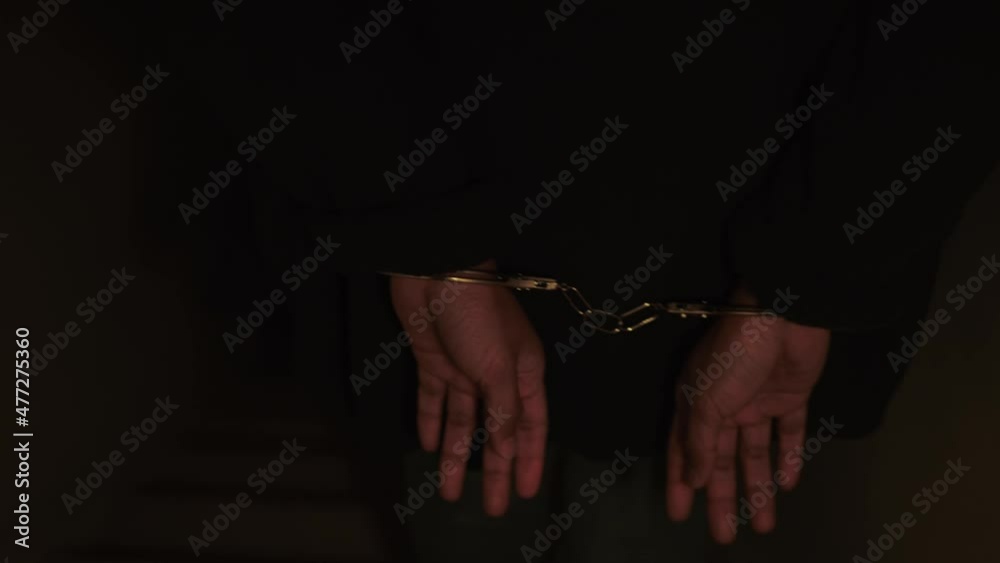 Woman handcuffed and brought out of the Crime Scene. Woman offender Woman handcuffed and brought out of the Crime Scene. Woman offender