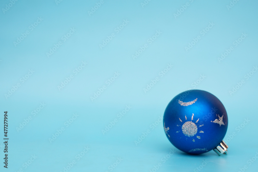 christmas ball on a blue background, place for text christmas ball on a blue background, place for text