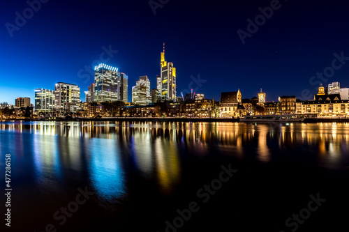 The skyline of Frankfurt - Main at night at a cold day in winter.