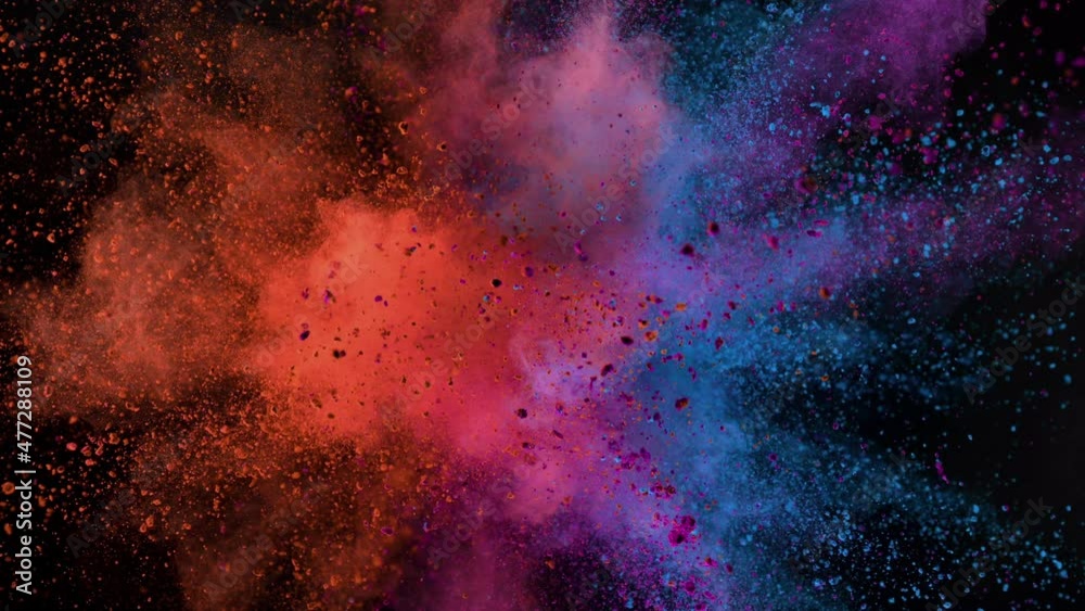 Super slow motion of colored powder explosion isolated on black background. Speed ramp effect. Filmed on high speed cinema camera, 1000fps.