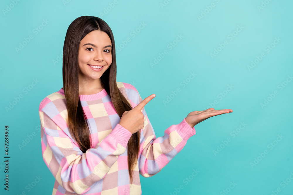 Photo of young lady indicate finger product advertise recommend isolated over turquoise color background Photo of young lady indicate finger product advertise recommend isolated over turquoise color background