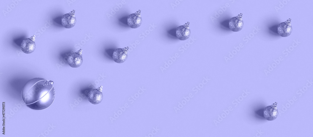 Very Peri Color of the year 2022. Violet. Purple Christmas decoration ball inside round frame of glitter balls. Flat Lay, Top View Very Peri Color of the year 2022. Violet. Purple Christmas decoration ball inside round frame of glitter balls. Flat Lay, Top View