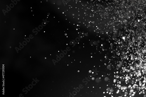 Black bokeh blur abstract background. Christmas and New year