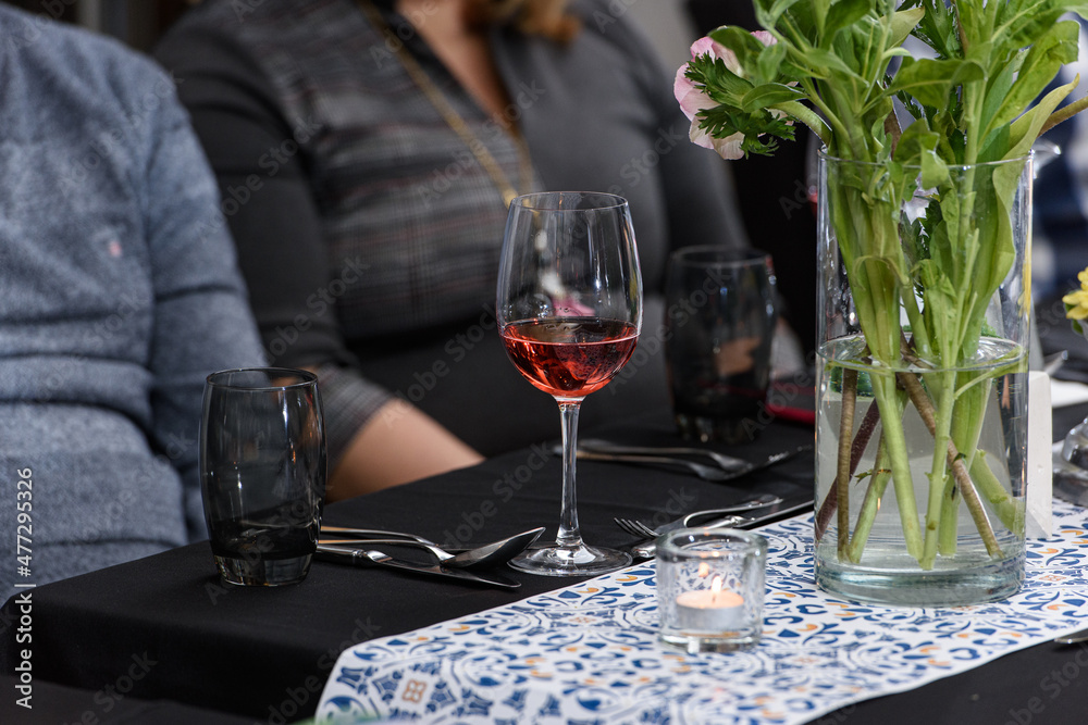 Glass of red wine on a served table in a restaurant Glass of red wine on a served table in a restaurant