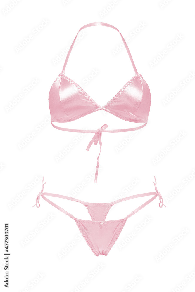 Detailed shot of a silk wireless bra and thong panties with a silk bow. The sexy pink lingerie set with ties is isolated on the white background. Detailed shot of a silk wireless bra and thong panties with a silk bow. The sexy pink lingerie set with ties is isolated on the white background.