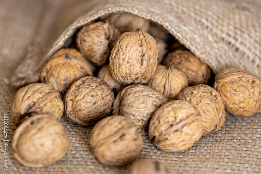 close-up of the nuts comes out of the jute bag, gluten free close-up of the nuts comes out of the jute bag, gluten free