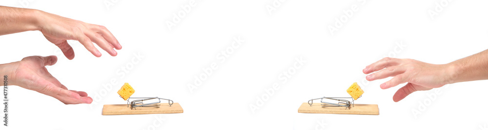 Banner, hands reach for cheese in mousetrap. Banner, hands reach for cheese in mousetrap.
