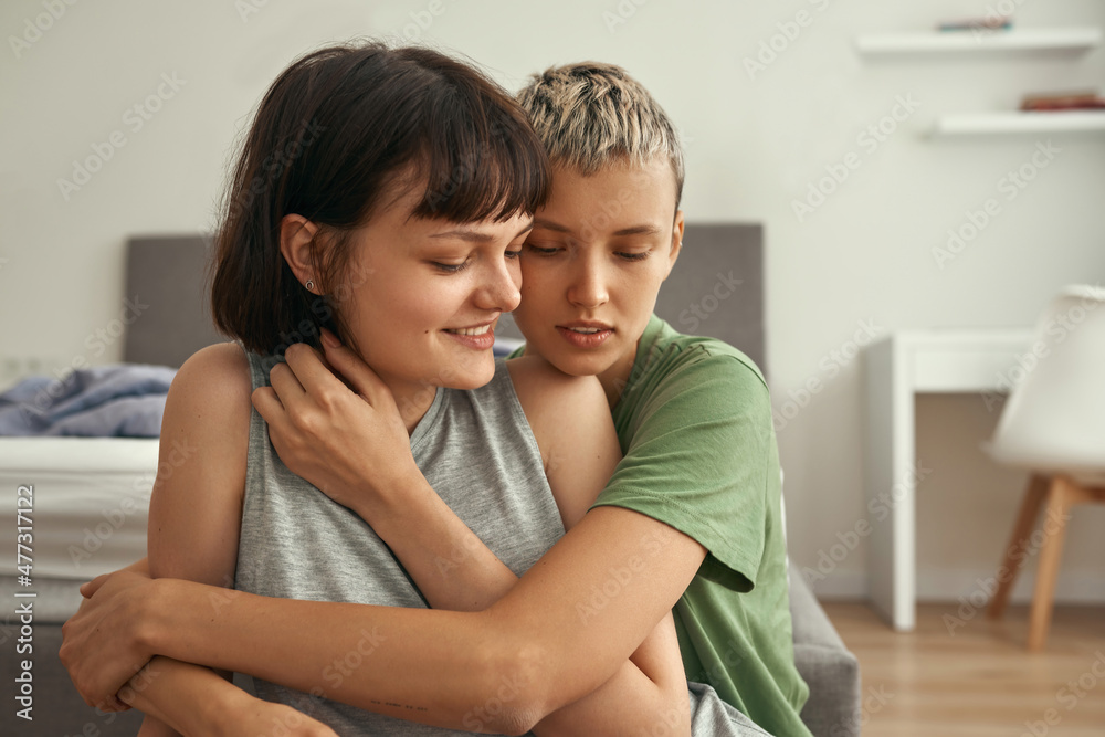Lesbian european couple rest and hug at home Lesbian european couple rest and hug at home