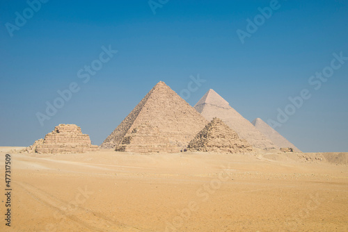 Landscape of the pyramids in the desert with blue sky in Giza, Egypt