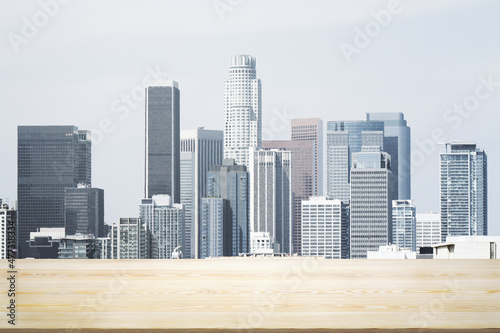 Blank tabletop made of wooden planks with beautiful Los Angeles cityscape at daytime on background  mockup