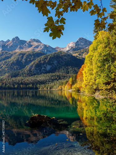 Fototapeta Naklejka Na Ścianę i Meble -  Autumn foliage reflections in the cristal clear waters of Tovel lake, Dolomites, Italy