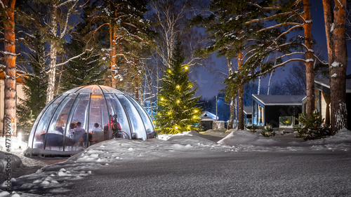 Fotografiet Dinner outdoors in a bubble in winter weather, lots of snow around to promote social distancing